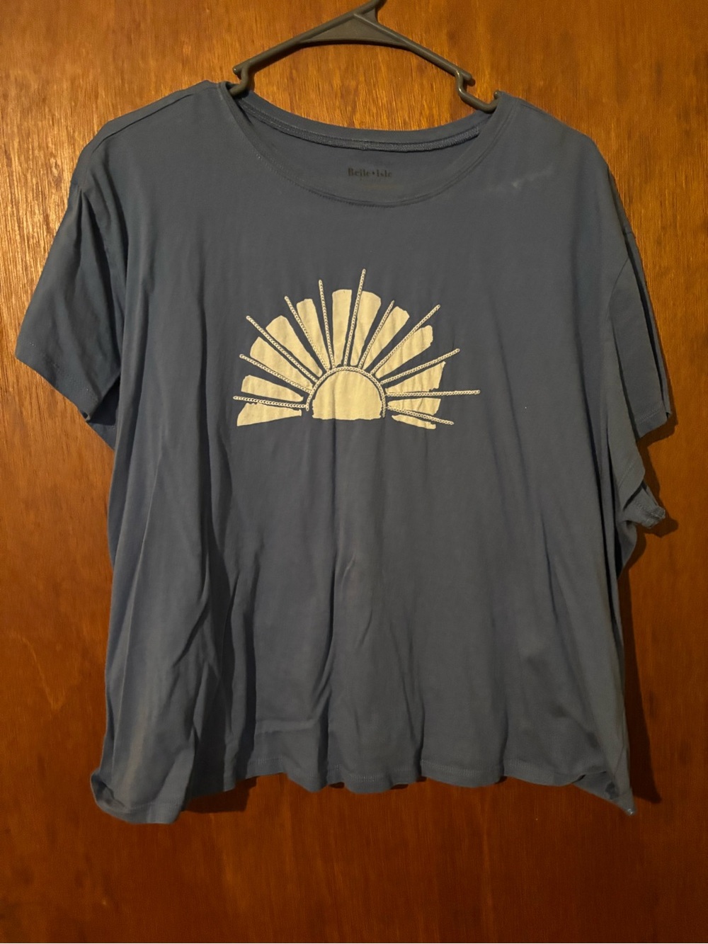 belle sky blue tee with cream sunburst graphic